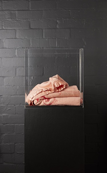 Tragedy Series: Pain & Healing. Blankets, especially those with satin borders, are associated with warmth and nurture. I imagine blankets like these on the beds of Macs Hotel, comforting the Admella survivors. Pink or 'flesh-colour' is evocative of skin. In this case the 'skin' has been embroidered with wound-like forms and anxiety-ridden stitches. Surgeon's sutures indicate that healing has begun.